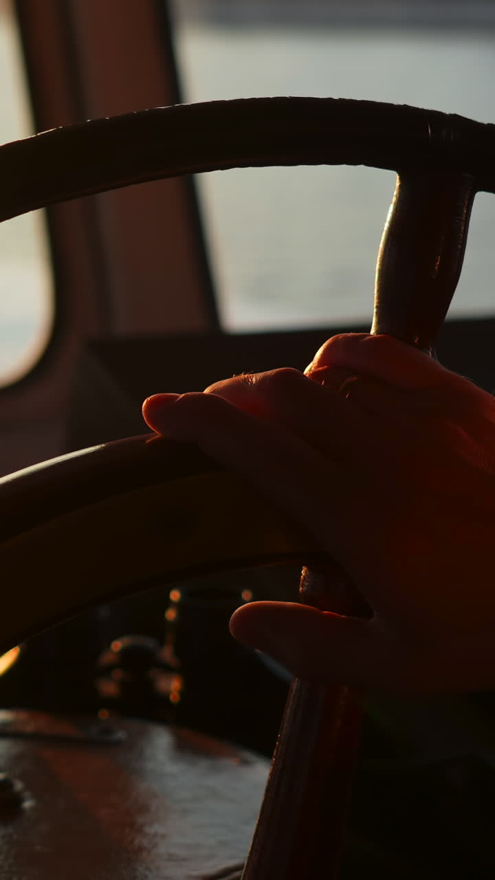 A classic steering wheel on a boat