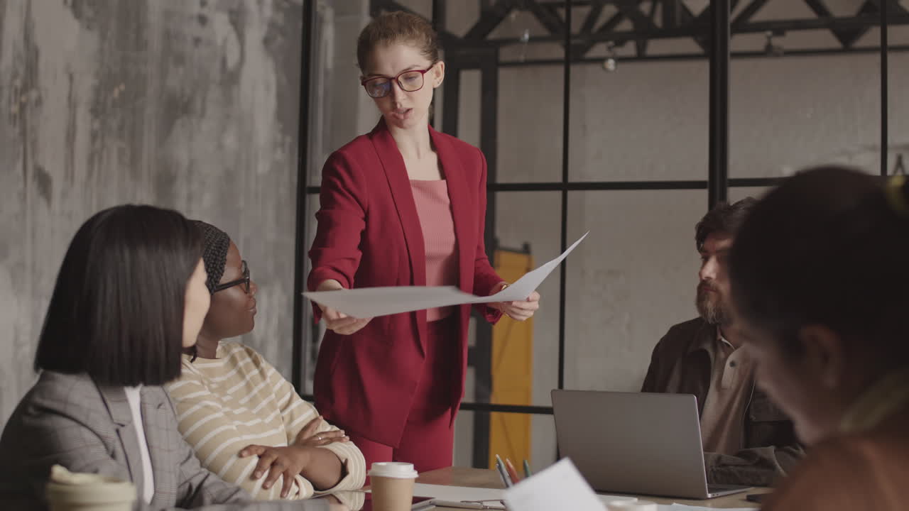 Office Worker Speaking at Business Meeting