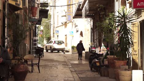 narrow street in old town with people