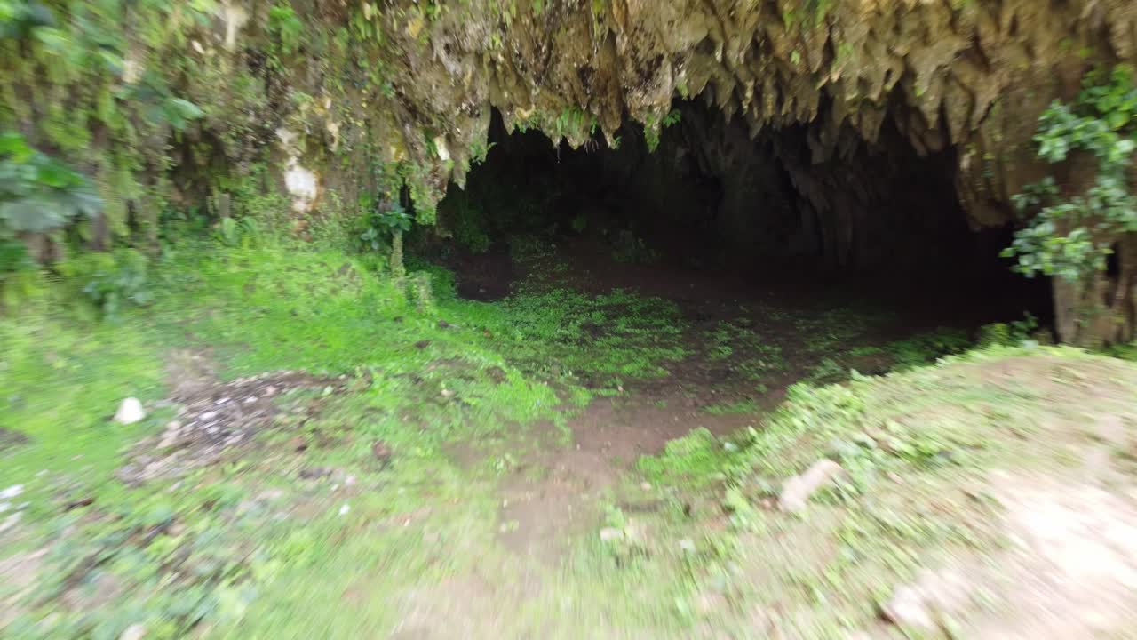Drone shot flying out of the popular karst cave on the panoramic highway in Saman&aacute; on the north shore of the Dominican Republic