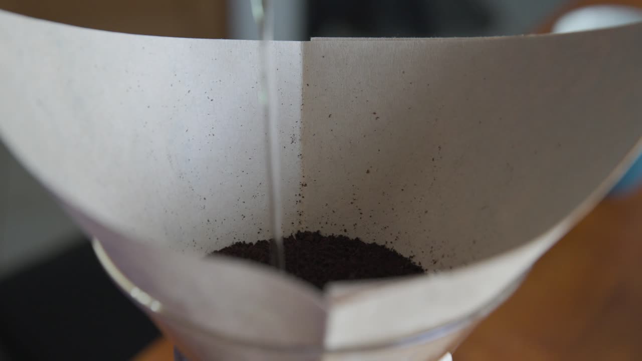 Slow Motion Pour Over Coffee Grounds with filter