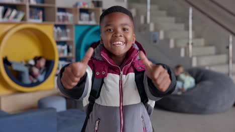 happy young student in library giving thumbs up