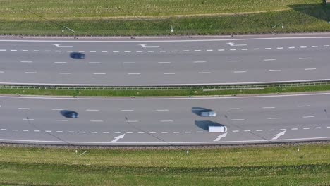 traffic flow in opposite directions on highway - aerial top down view