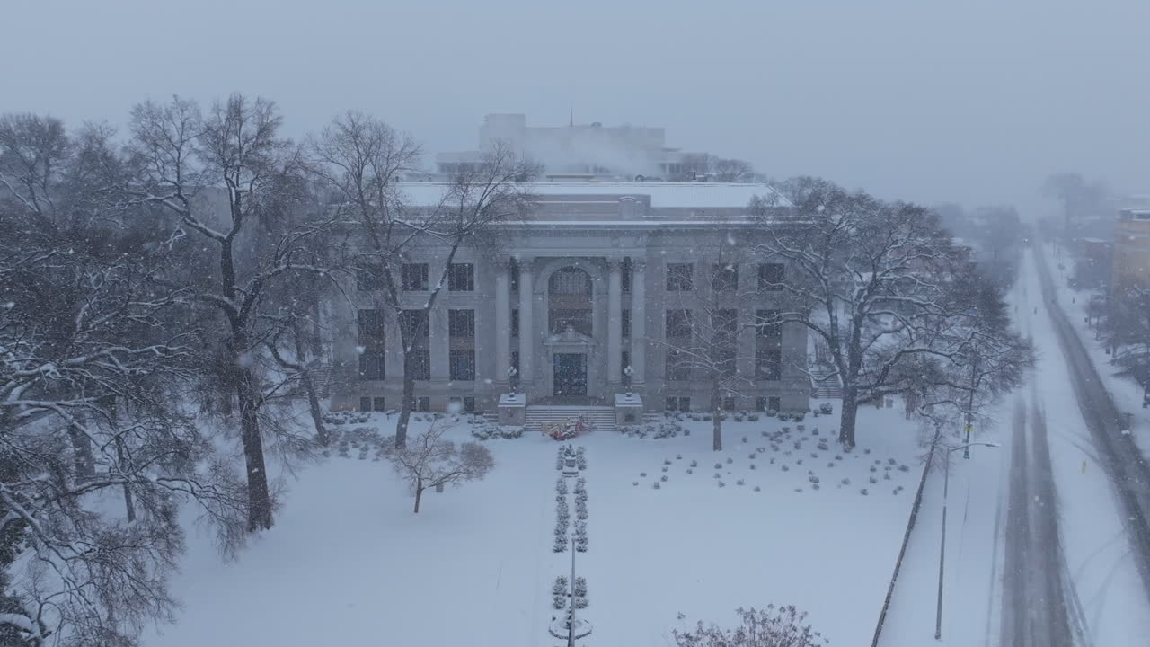 Static aerial footage of the Hamilton County Courthouse in Chattanooga, TN during a snowstorm.