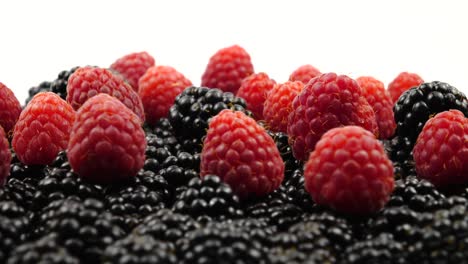 ripe raw berries of raspberry and blackberry, background