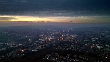 Aerial-Drone-Skyline-Of-a-busy-City-Town-At-Sunset