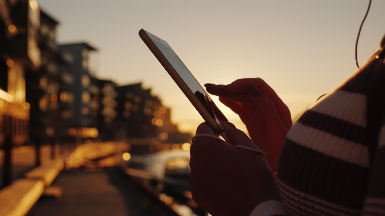 Hands Of A Woman With A Smartphone On The Background Of A Pier With Yachts At Sunset 4k Video