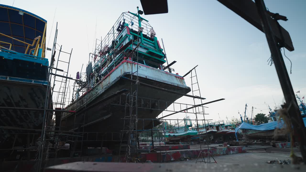 Fishing Boats Under Repair in a Shipyard