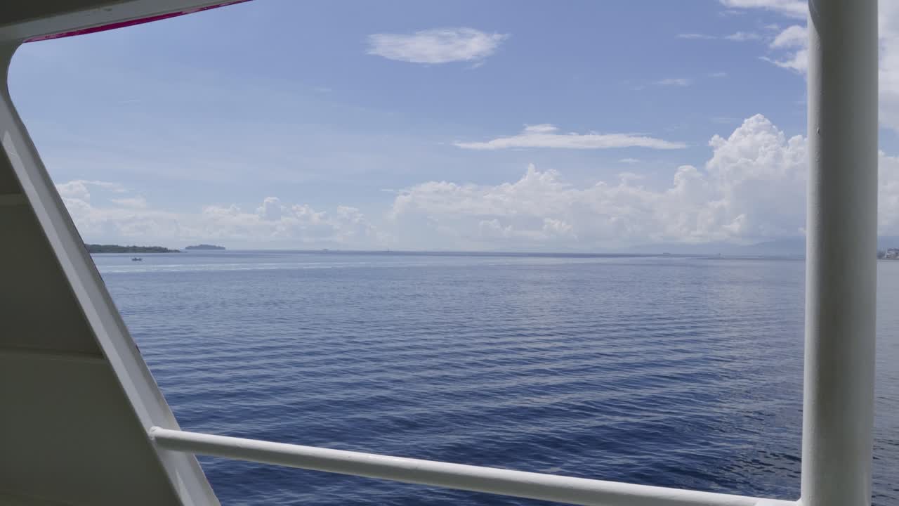 Beautiful view from side of cruise ship on sunny day with clear blue skies