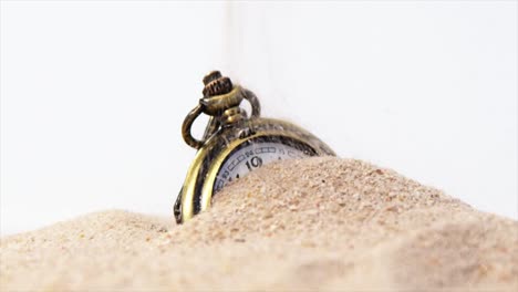 Alarm-clock-in-sand