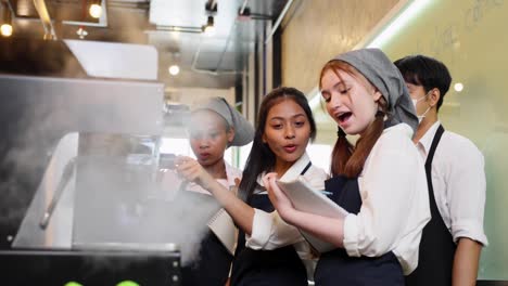 barista learning make coffee by espresso machine. group schoolgirl studying hard to learn how to make espresso coffee at barista school.