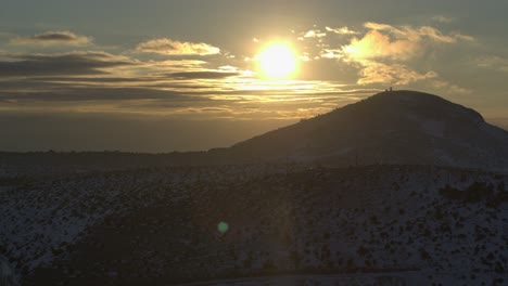 Aerial---Golden-sunset-with-clouds-behind-snowy-mountain---Shot-on-DJI-Inspire-2-X7-50mm-RAW