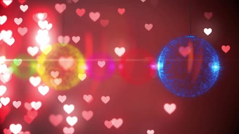 Animation-of-christmas-decorations-over-glowing-pink-hearts