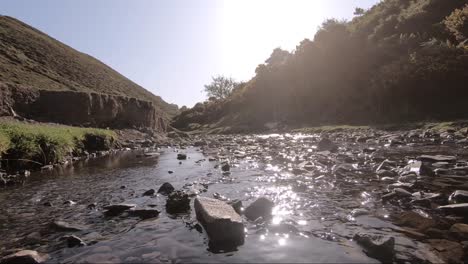 small stream flowwing away from camera, church stretton, long mynd, shropshire hills at sunrise