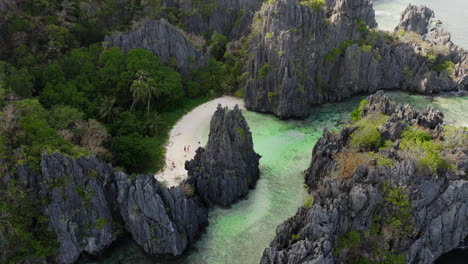 aerial shot revealing hidden beach in el nido, palawan, philippines