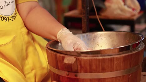 hands crafting dumplings at a street food stall