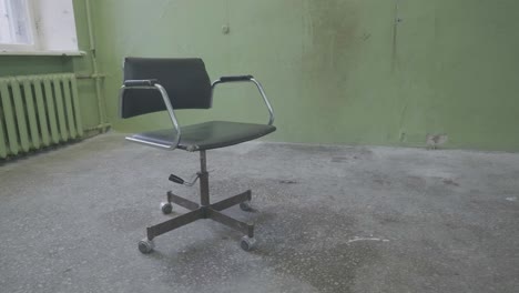 old office chair in an empty room