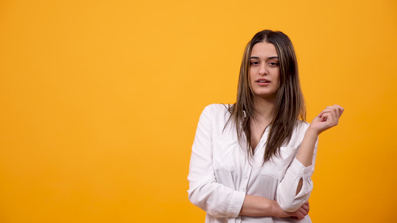 Portrait of a Woman in White Shirt on Yellow Background