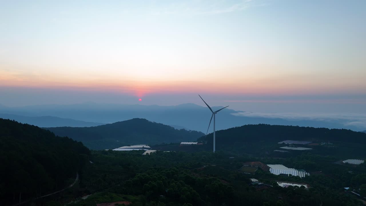 Wind power turbines on high hills in Vietnam at sunrise - Wind power
