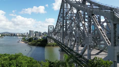 brisbane's story bridge from fortitude valley as cars go past