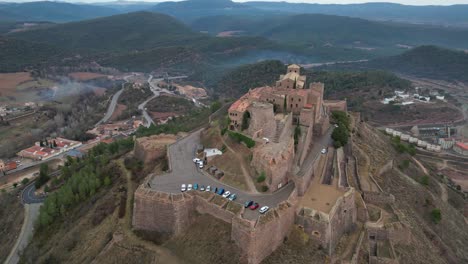 cardona castle overlooks the surrounding town and landscape from a high vantage point