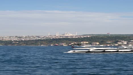 istanbul cityscape with mosque and boats on the bosphorus