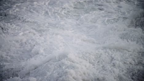 large waves roll into the coast of hawaii in slow motion