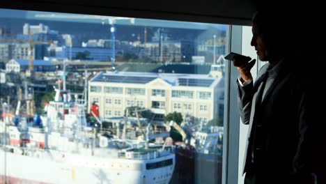 Businessman-talking-on-mobile-phone-in-hotel-room-4k