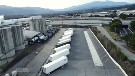 industrial area with trucks and railcars
