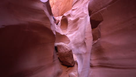 Walking-Between-Red-Eroded-Rocks,-Slot-Narrow-Canyon,-Natural-Wonder-in-Antelope-Canyon,-Arizona-USA,-Full-Frame