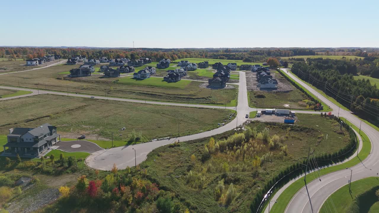 Aerial view of new Alton homes, fall leaves, housing shortage context