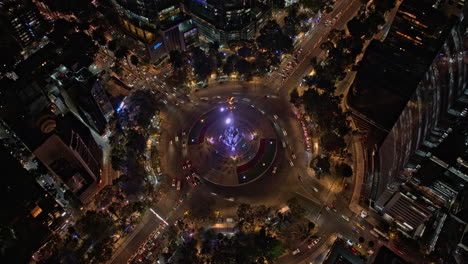 Ciudad-De-México-Aérea-V3-Hiperlapso-Vista-De-Pájaro-Del-ángel-Iluminado-De-La-Independencia-Con-Tráficos-De-Rotonda-Ocupados-Y-Paisaje-Urbano-Nocturno-Futurista-En-El-Centro---Filmado-Con-Cine-Mavic-3---Diciembre-De-2021