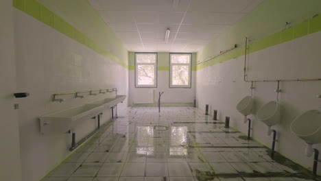 public school toilets in construction zoom out slow motion. montpellier