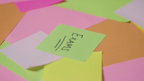 Education-Concept-Of-Revolving-Sticky-Notes-With-Exams-Written-On-Top-Note-1