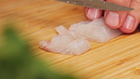 preparing fish for sushi or sashimi