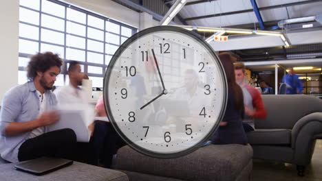 animation of clock ticking over diverse business people in office