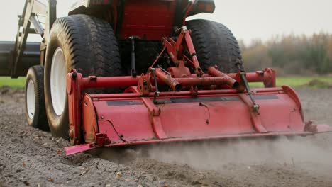 tractor tilling a field