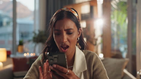 woman with smartphone expressing frustration