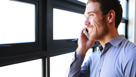 Businessman-talking-on-mobile-phone