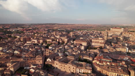 Establishing-shot-drone-flyover-of-ancient-walled-city-of-Toledo,-Spain