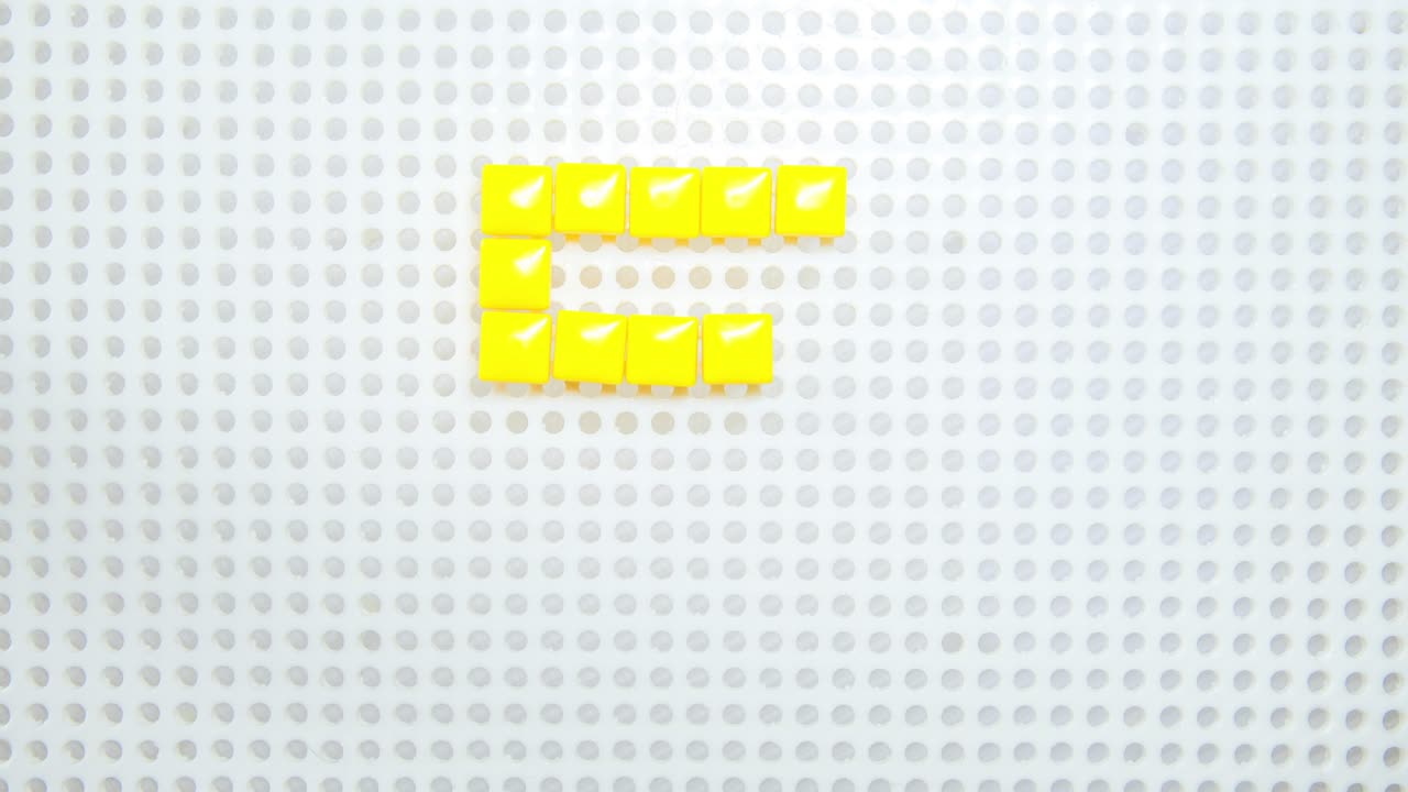 stop motion of the number 5 creating one pixel at the time, made with children toys