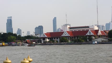 bangkok riverfront with temples and city skyline