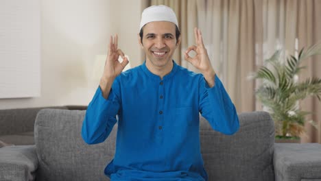 happy muslim man showing okay sign