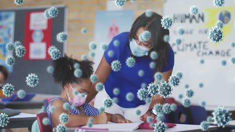 animación de células de covid-19 sobre una niña afroamericana y un maestro con máscaras faciales