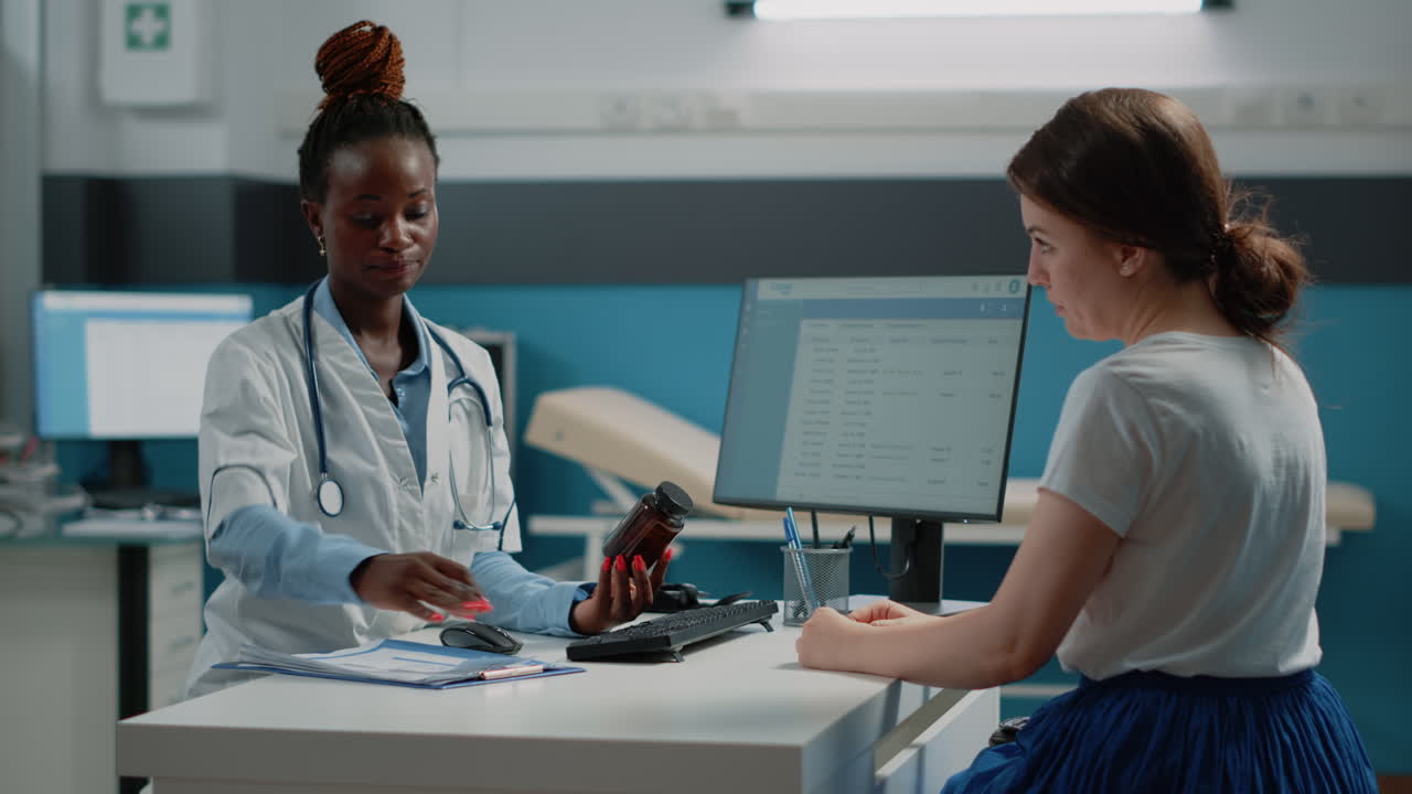 Doctor Consulting with Patient in Clinic