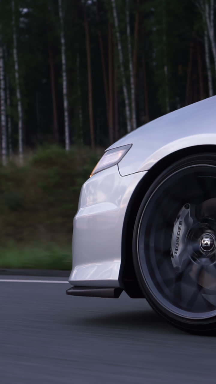 Silver Car Driving on a Road