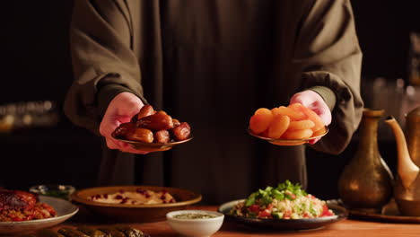 woman serving dates and apricots