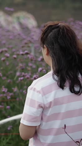 woman in a field of purple flowers