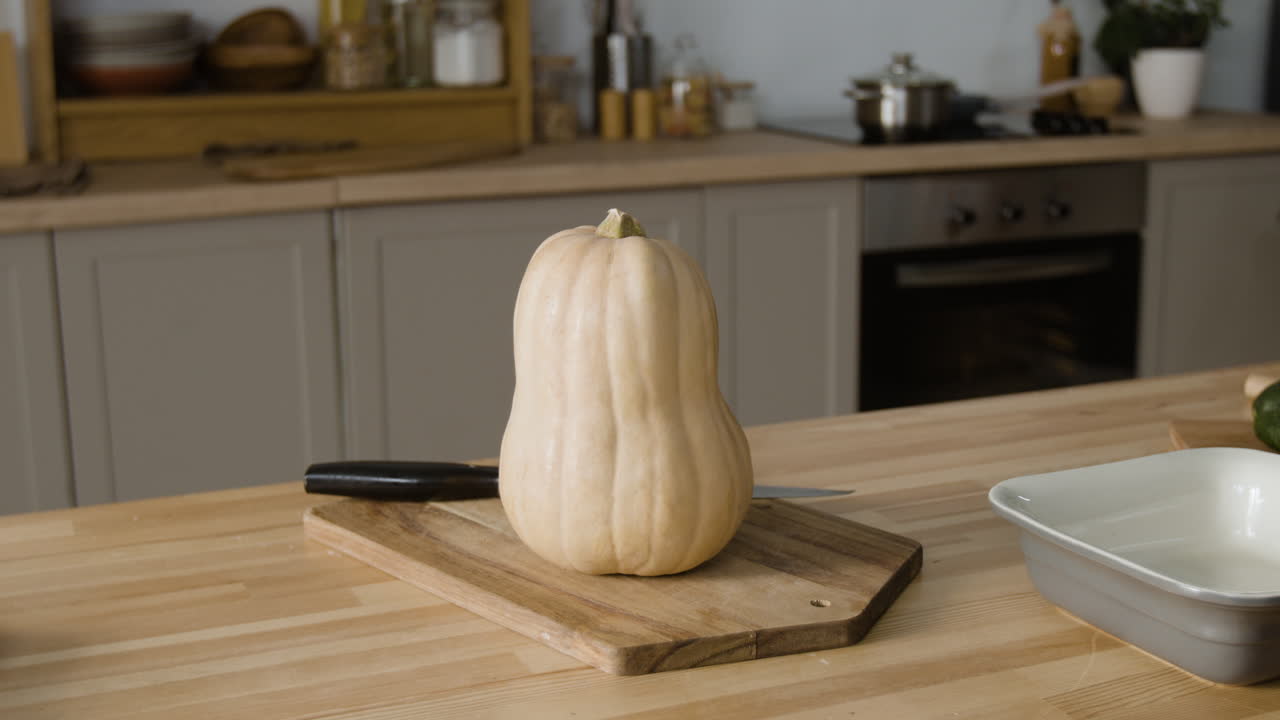 Butternut Squash on a Cutting Board in a Kitchen