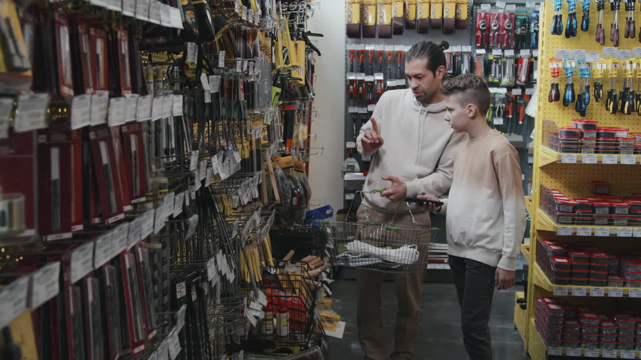 Man and Kid Shopping at Hardware Store
